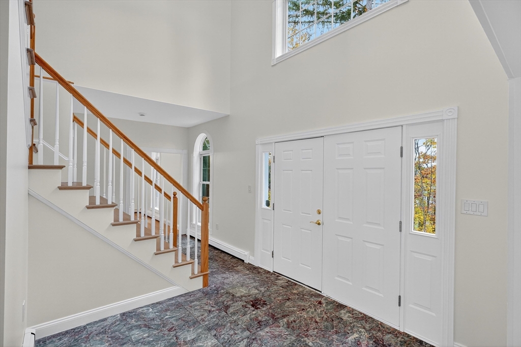 14 Pine Hill Road Framingham, MA 01701 - Photo 5 of 42 a view of entryway with wooden floor