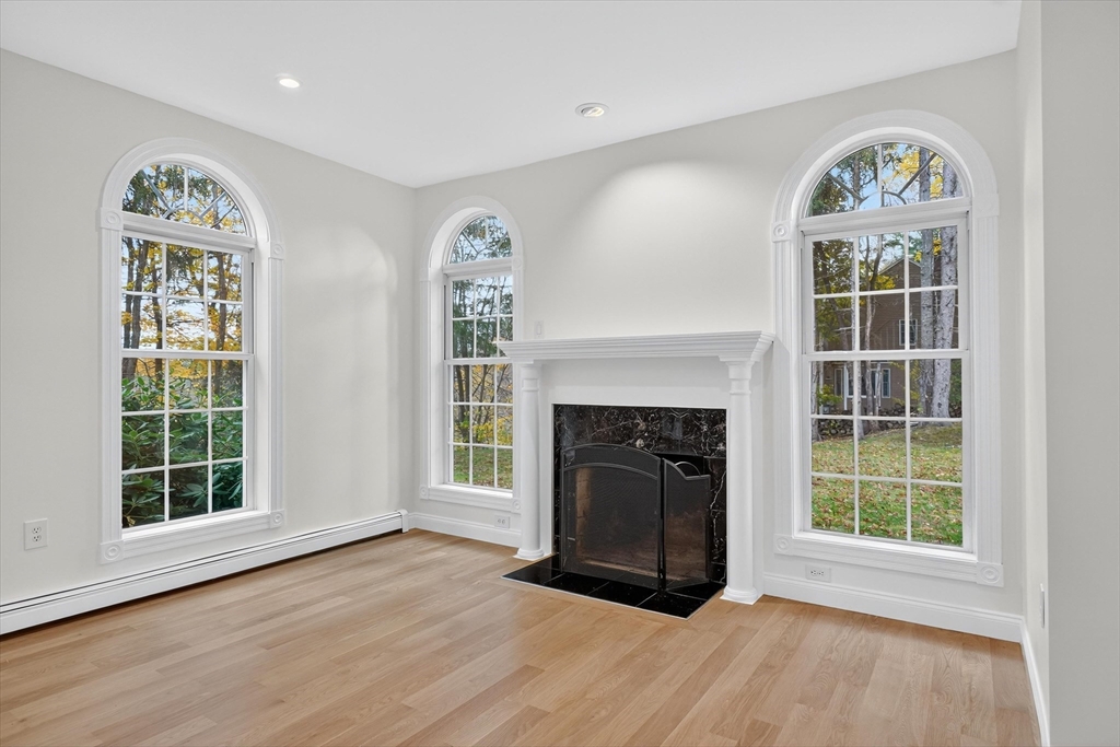 14 Pine Hill Road Framingham, MA 01701 - Photo 9 of 42 a view of an empty room with a window and fireplace
