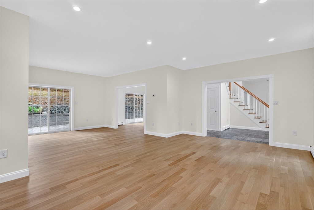 14 Pine Hill Road Framingham, MA 01701 - Photo 10 of 42 a view of an empty room with wooden floor and a window
