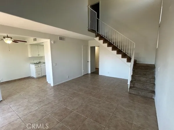 a view of entryway and kitchen