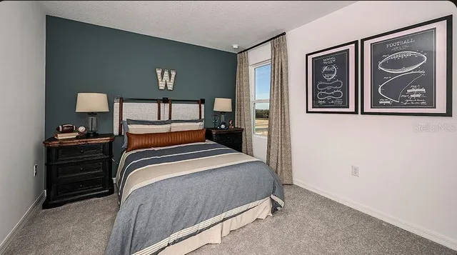 a bedroom with a bed and a couch