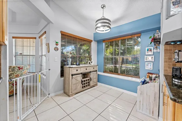 a kitchen with stainless steel appliances a refrigerator sink and microwave