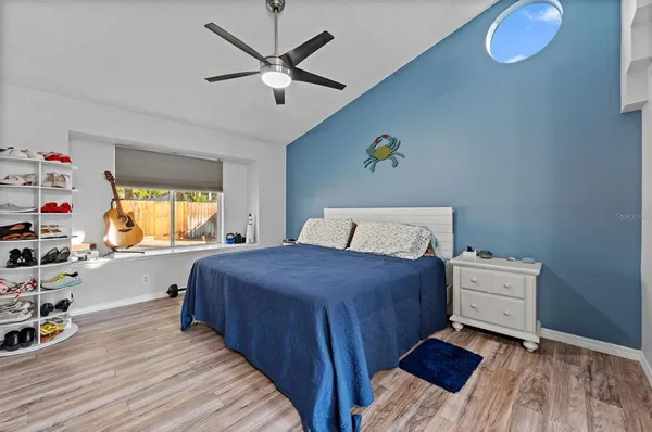 a bathroom with a granite countertop sink mirror double vanity and bathtub