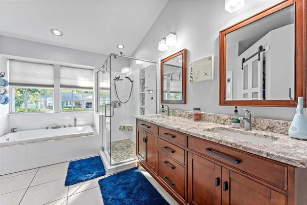 a bathroom with a shower and a sink