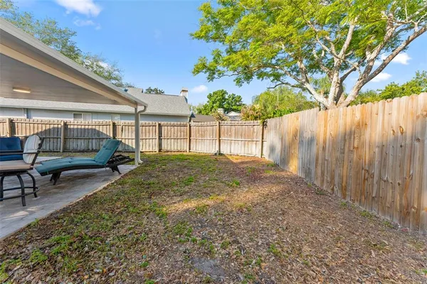 swimming pool view with a backyard space