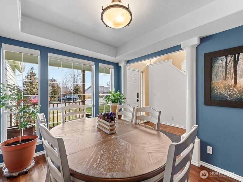 1504 Fuller Street Wenatchee, WA 98801 - Photo 17 of 38 a dining room with furniture a potted plant and a chandelier