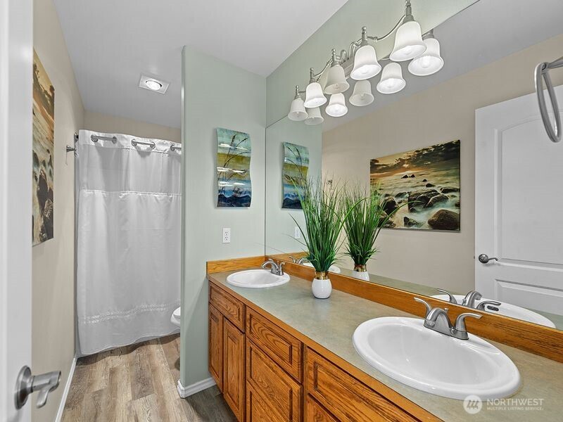 1504 Fuller Street Wenatchee, WA 98801 - Photo 24 of 38 a bathroom with a double vanity sink and a mirror