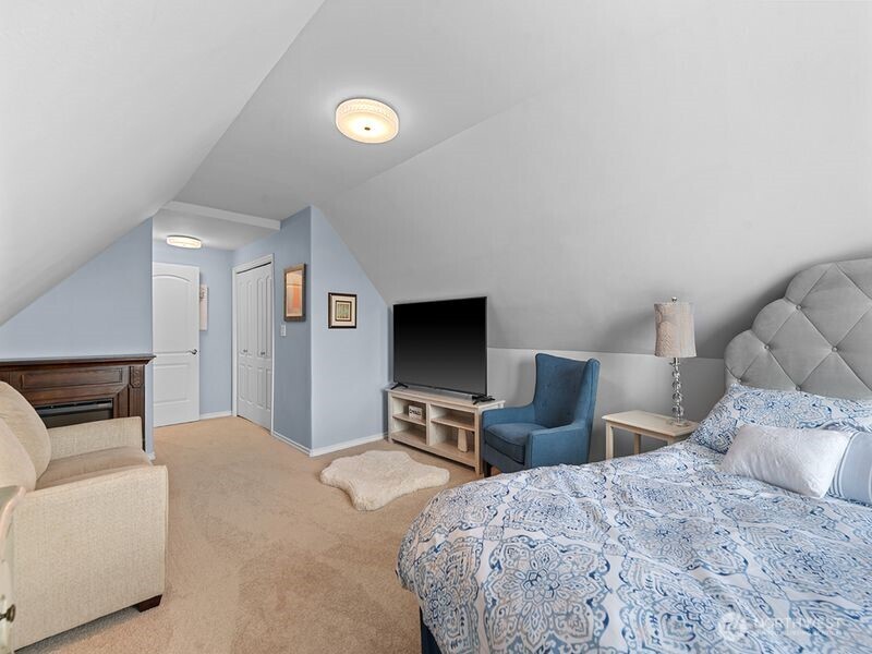 1504 Fuller Street Wenatchee, WA 98801 - Photo 26 of 38 a bedroom with a bed and a flat screen tv