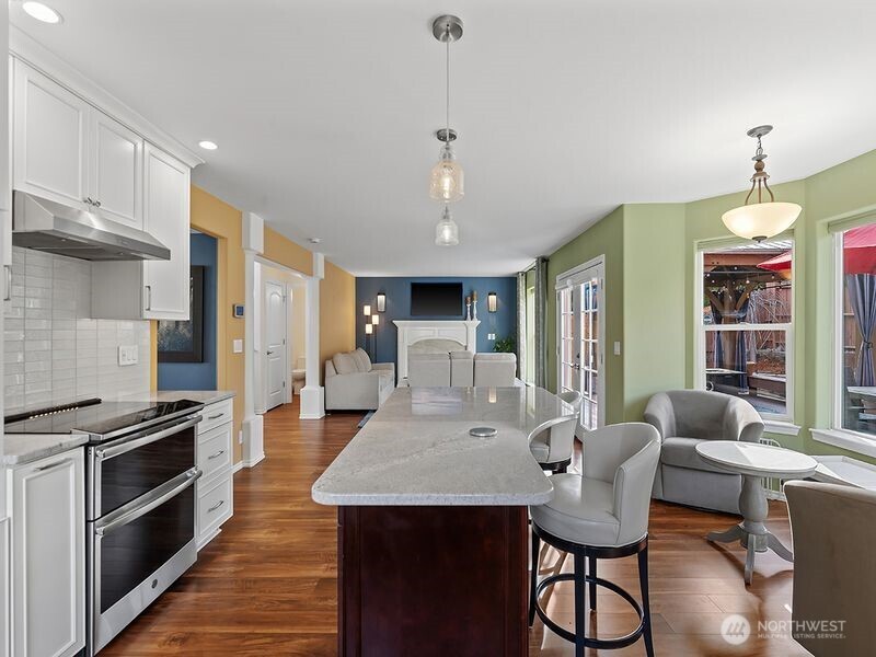 1504 Fuller Street Wenatchee, WA 98801 - Photo 10 of 38 a kitchen with granite countertop a stove and a refrigerator