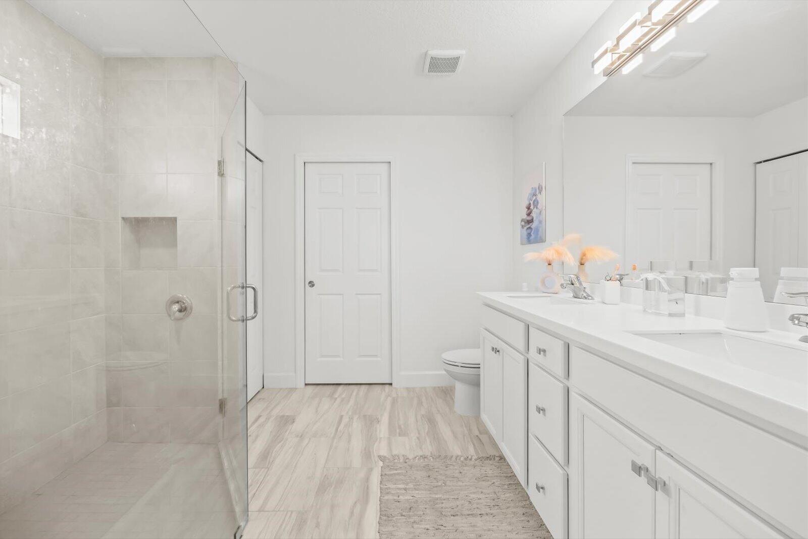 8607 Southwest 7th Lane Okeechobee, FL 34974 - Photo 20 of 44 a bathroom with a sink a toilet and shower