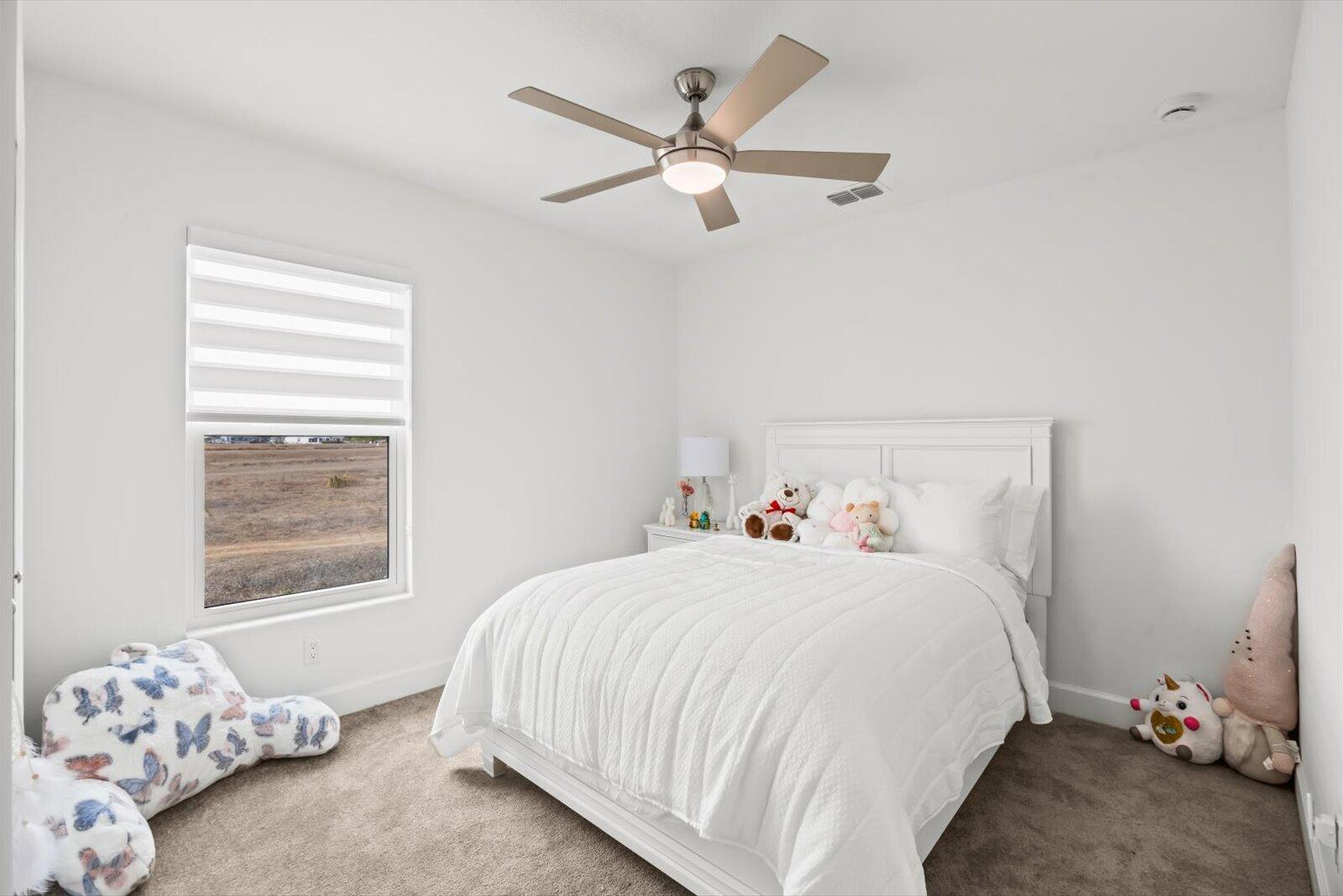 8607 Southwest 7th Lane Okeechobee, FL 34974 - Photo 27 of 44 a bedroom with a bed and a window