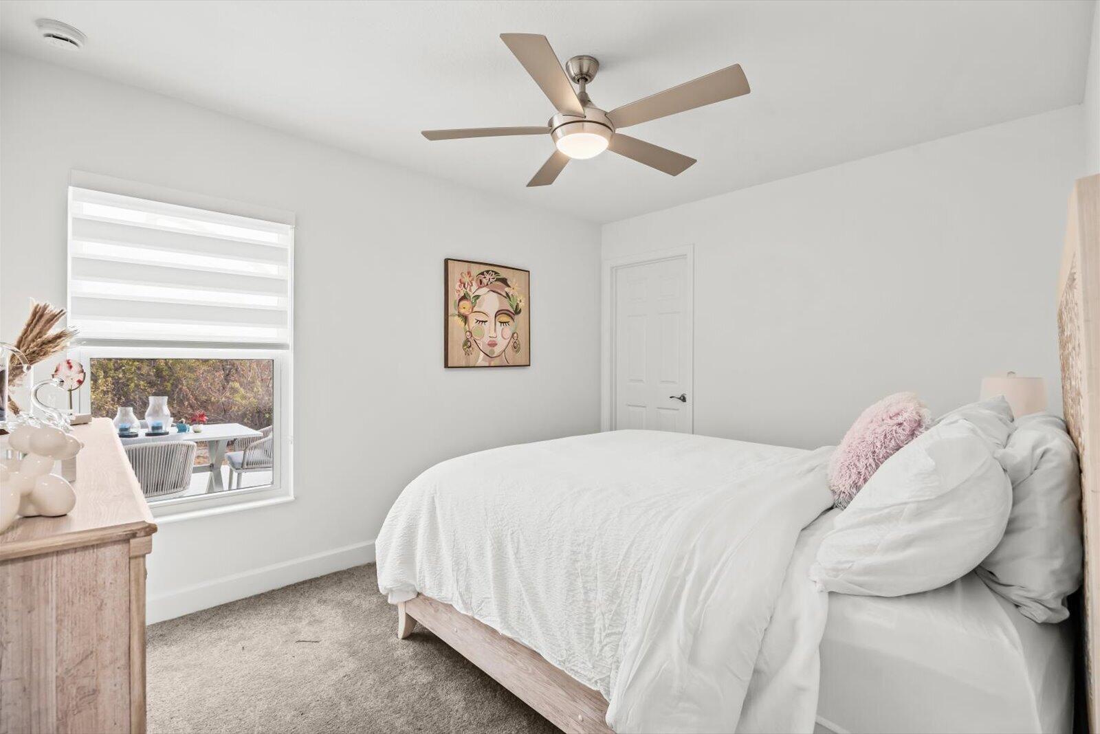 8607 Southwest 7th Lane Okeechobee, FL 34974 - Photo 30 of 44 a bedroom with a bed and a window
