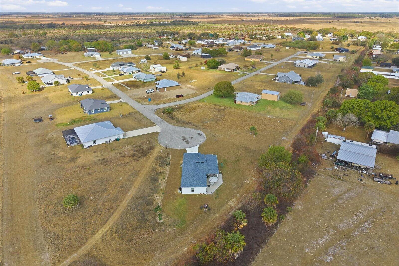 8607 Southwest 7th Lane Okeechobee, FL 34974 - Photo 42 of 44 an aerial view of residential houses with outdoor space
