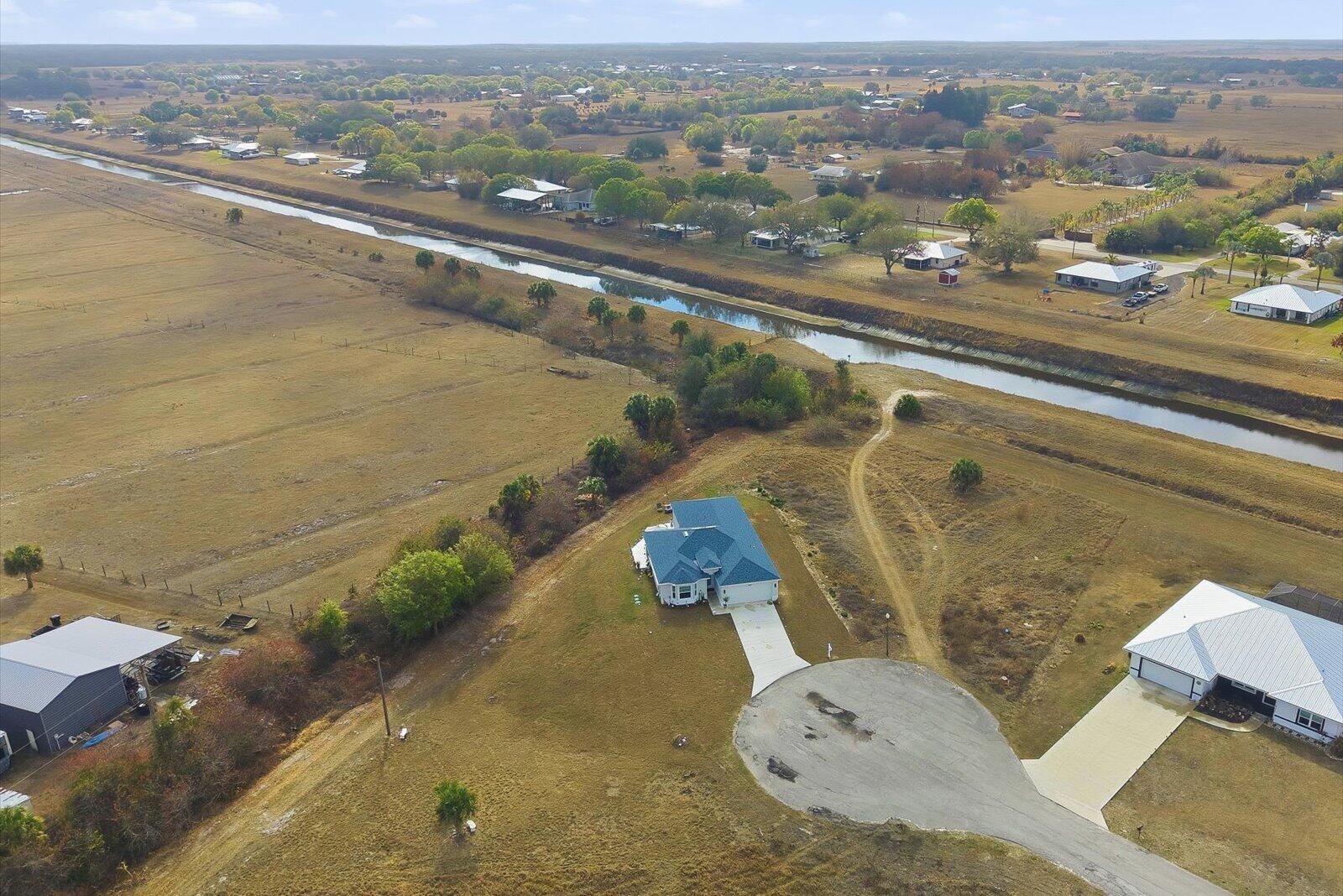 8607 Southwest 7th Lane Okeechobee, FL 34974 - Photo 44 of 44 an aerial view of residential houses with outdoor space