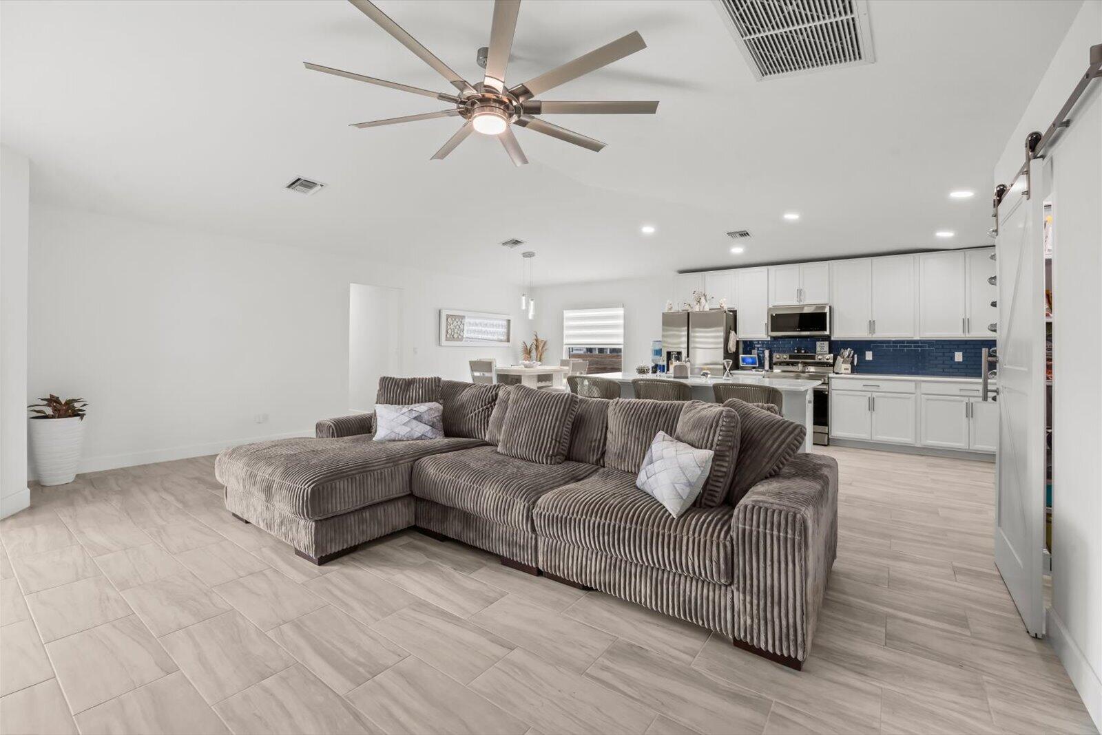 8607 Southwest 7th Lane Okeechobee, FL 34974 - Photo 6 of 44 a living room with furniture and kitchen view