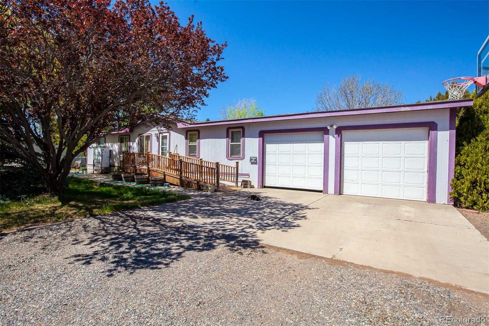 3281 C Road Palisade, CO 81526 - Photo 29 of 33 a front view of a house with a yard and garage