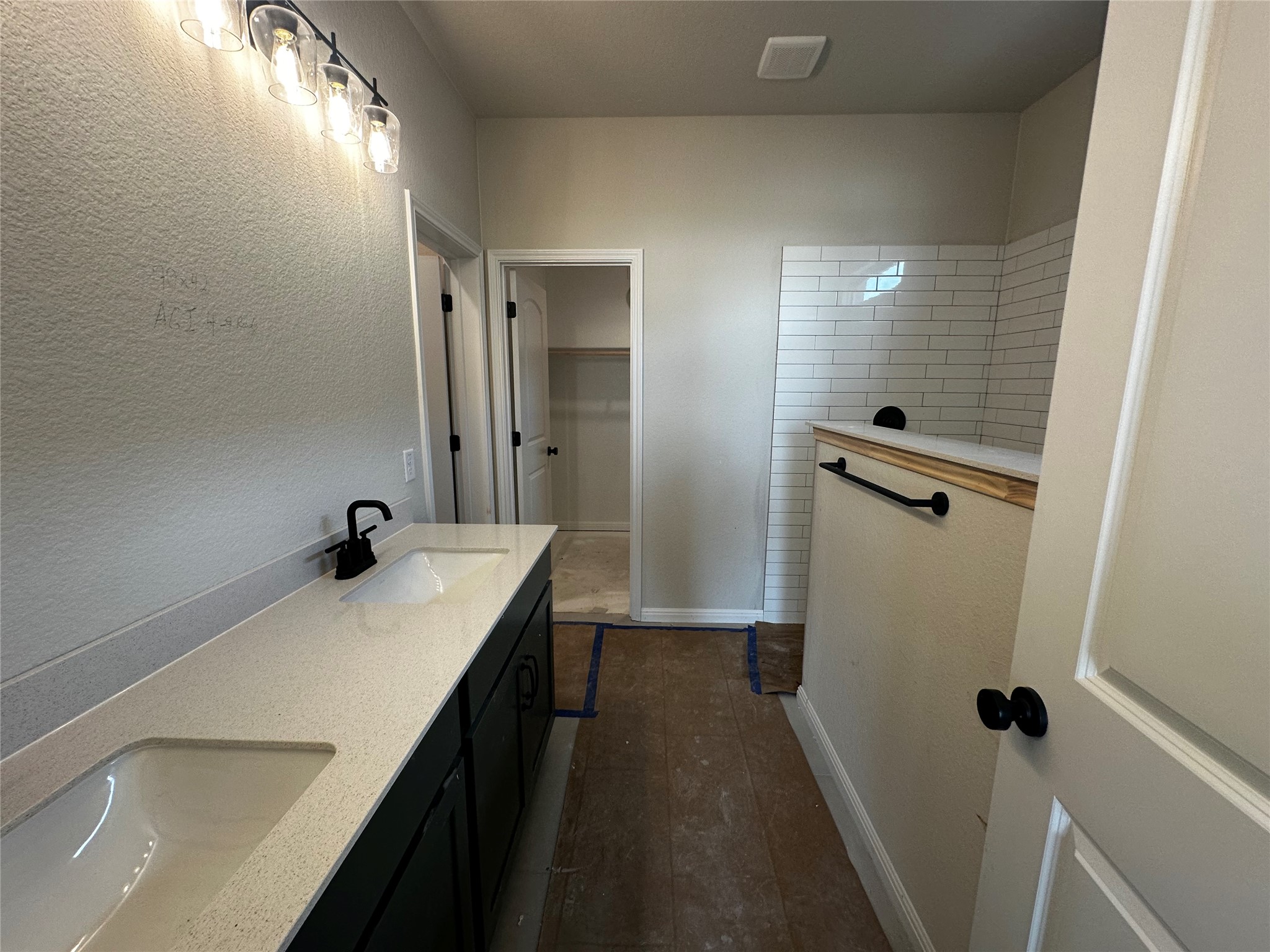 1053 Sienna Bear Road Georgetown, TX 78633 - Photo 14 of 32 a bathroom with a sink a mirror and shower
