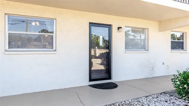 a view of an entryway with wooden floor
