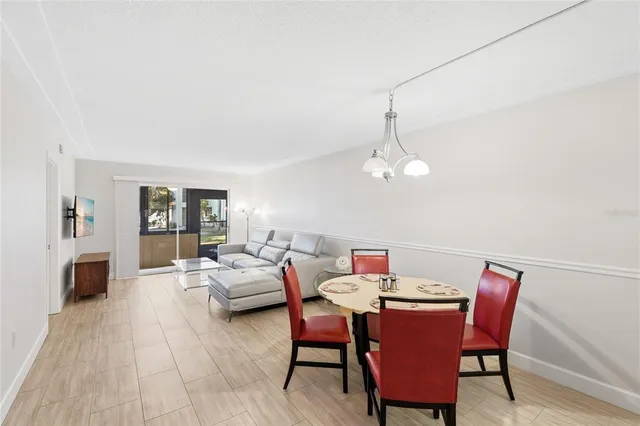 a dining room with furniture and window
