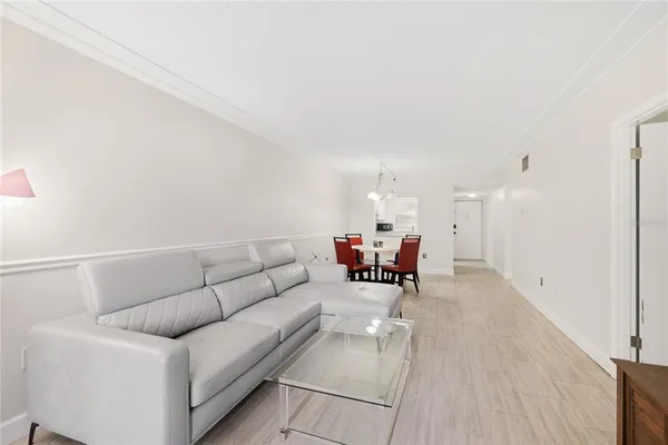 a living room with furniture and a table