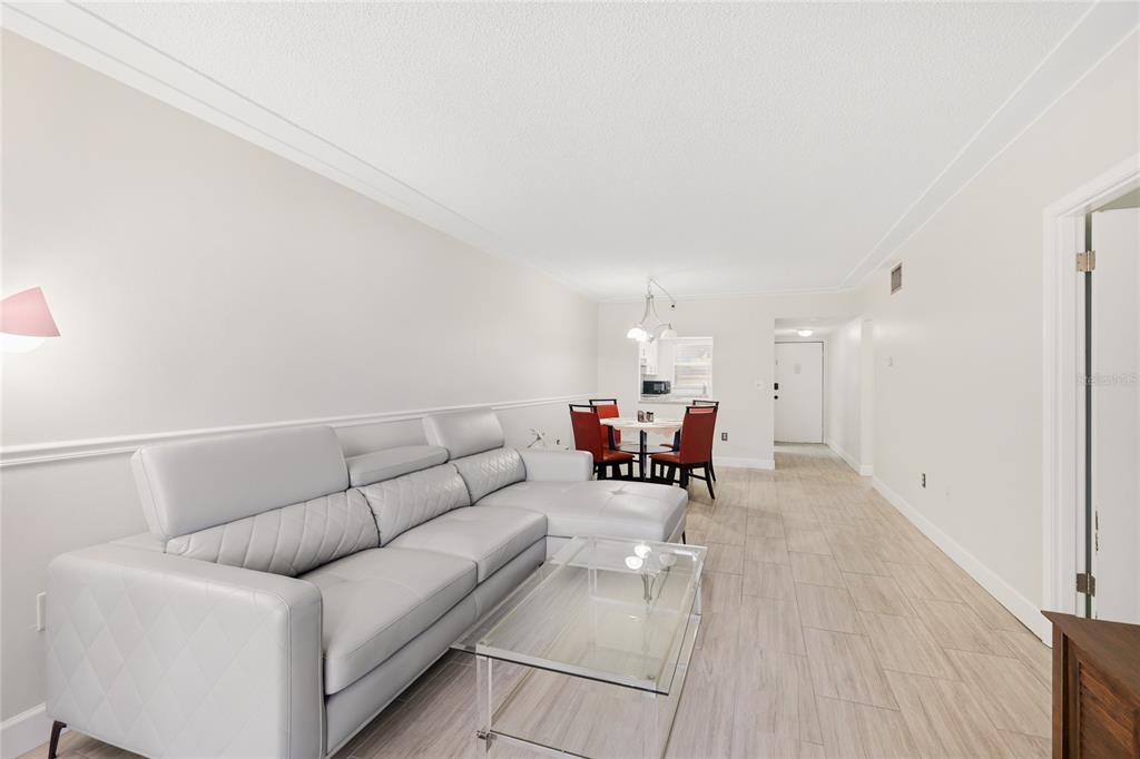 2300 Stickney Point Road, Unit 102 Sarasota, FL 34231 - Photo 6 of 32 a living room with furniture and a table