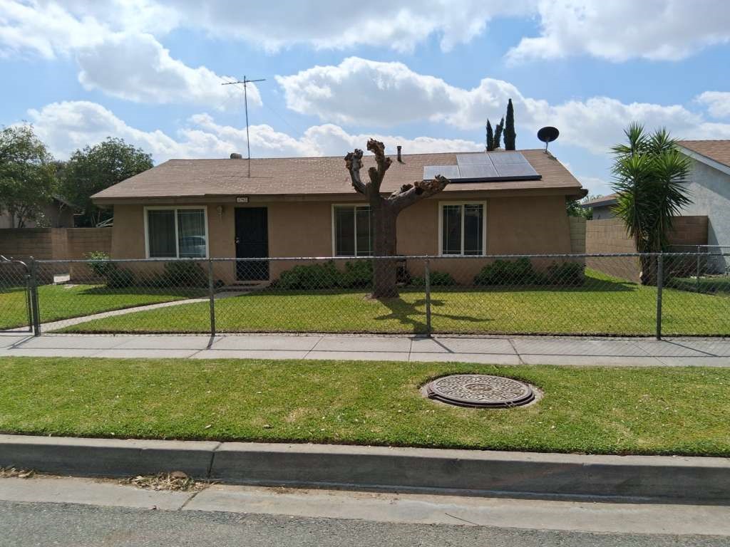 485 East Randall Avenue Rialto, CA 92376 - Photo 2 of 37 a front view of a house with garden