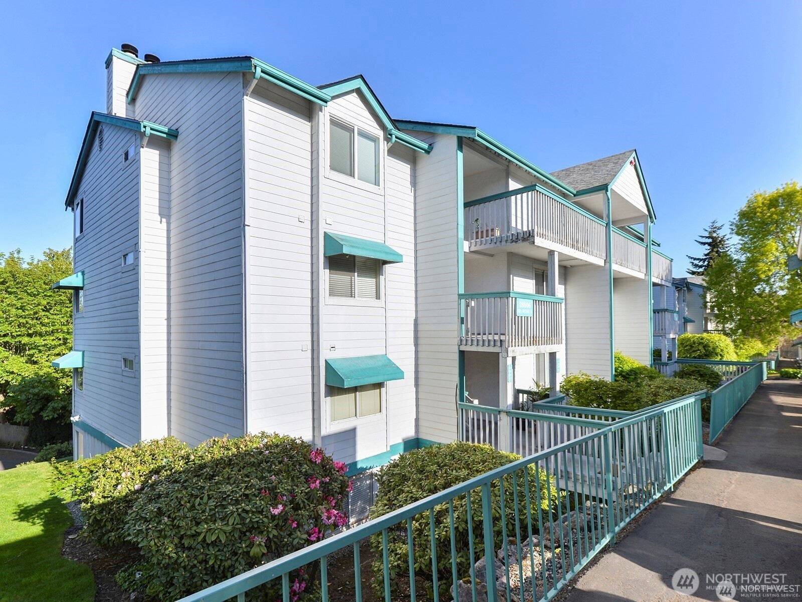 28606 16th Avenue South, Unit 102 Federal Way, WA 98003 - Photo 1 of 1 a view of a house with wooden fence and two windows