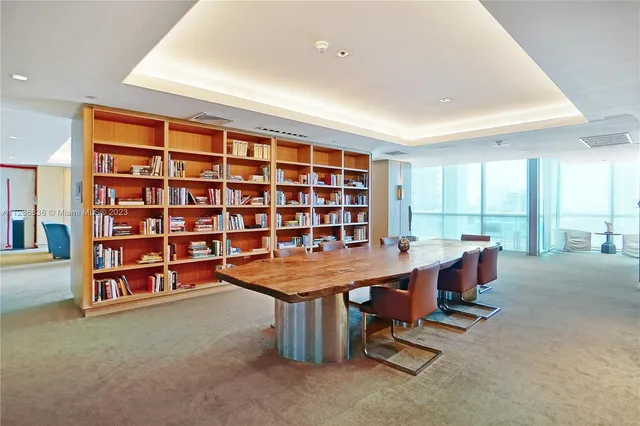 a view of a workspace with furniture in a room