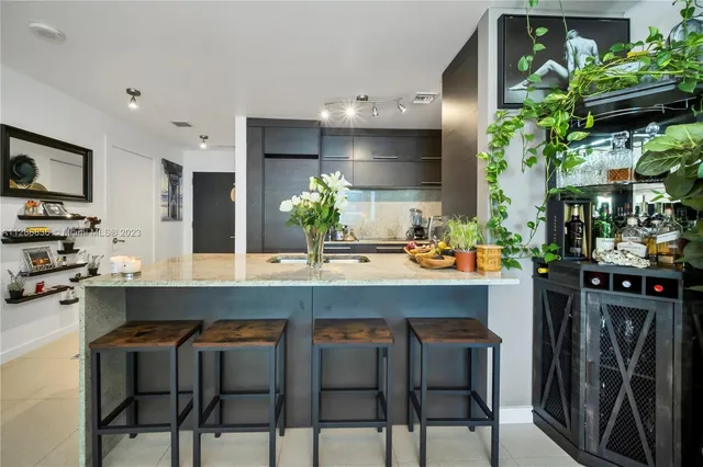 a kitchen with a table and chairs in it