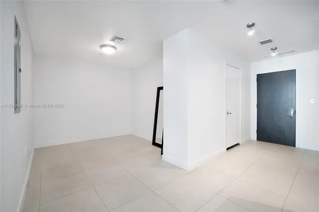 an empty room with entrance and door