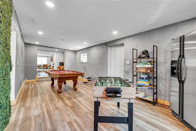 a view of empty room with wooden floor and cabinet