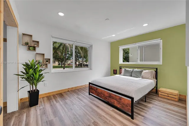 a view of a livingroom with furniture and a flat screen tv
