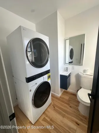 a bathroom with a toilet and a sink
