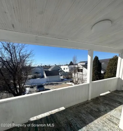 a view of a couch in a balcony