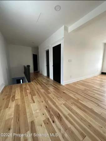 a bedroom with a bed and a walk in closet