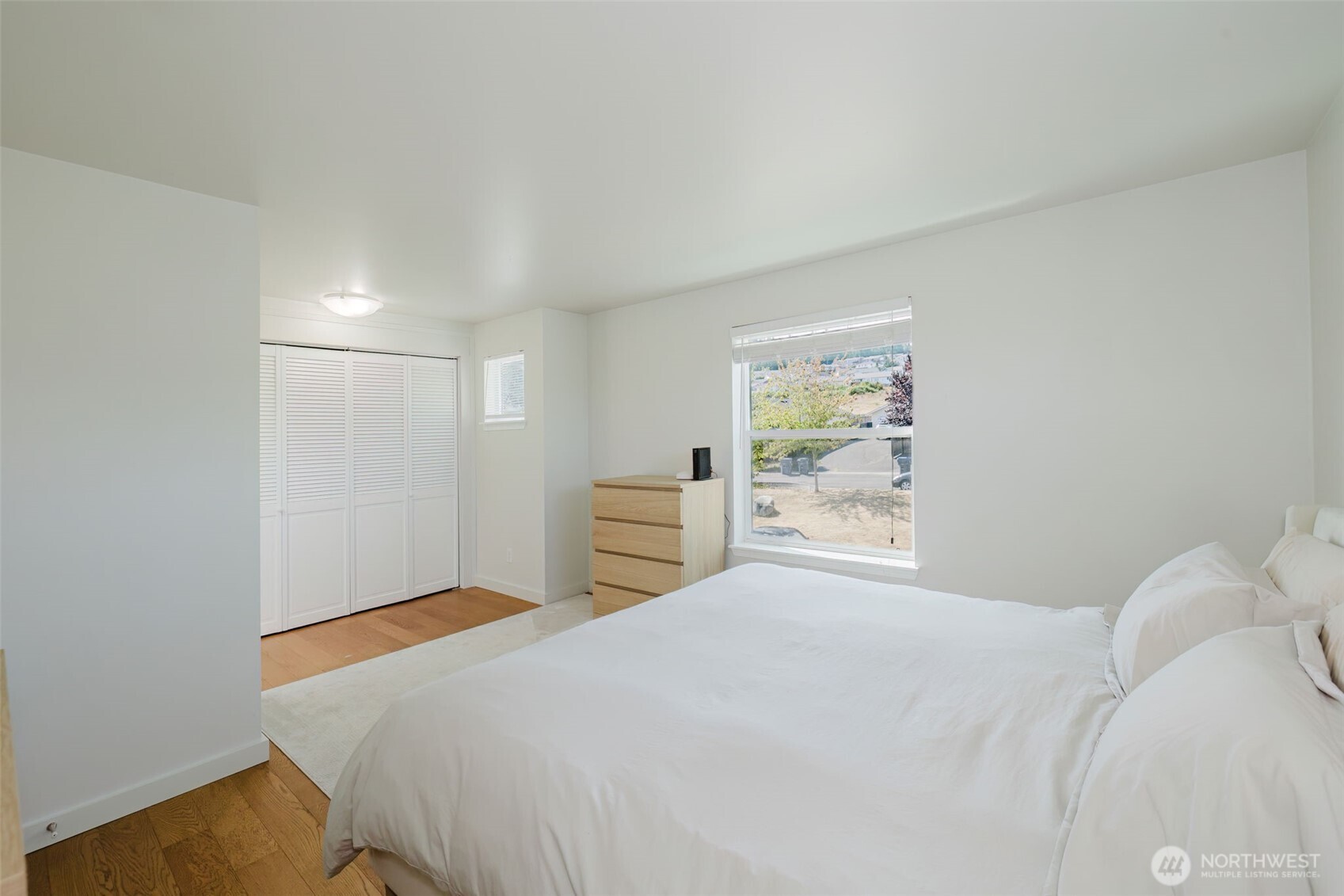 131 Alpine Loop Sequim, WA 98382 - Photo 16 of 19 a bedroom with a bed and a window