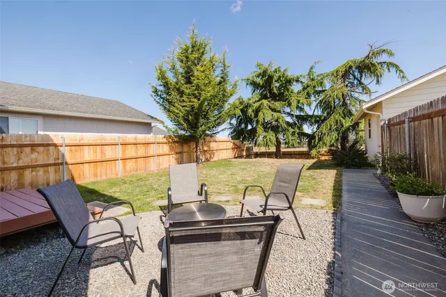 a view of a swimming pool with outdoor seating