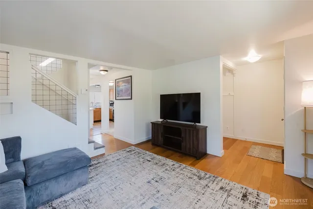 a bedroom with furniture and a flat screen tv
