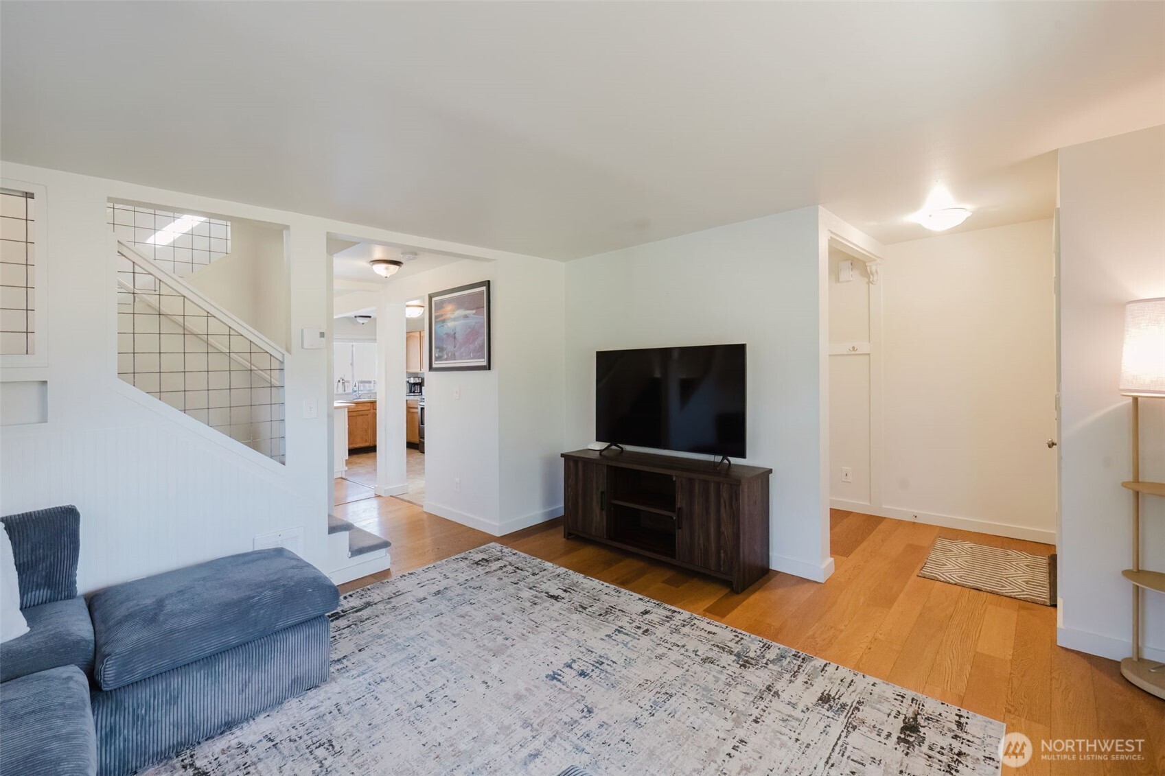 131 Alpine Loop Sequim, WA 98382 - Photo 4 of 19 a bedroom with furniture and a flat screen tv