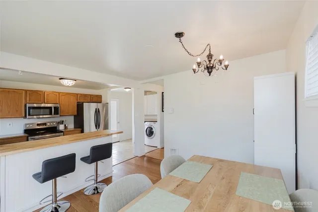 a bedroom with furniture and a chandelier