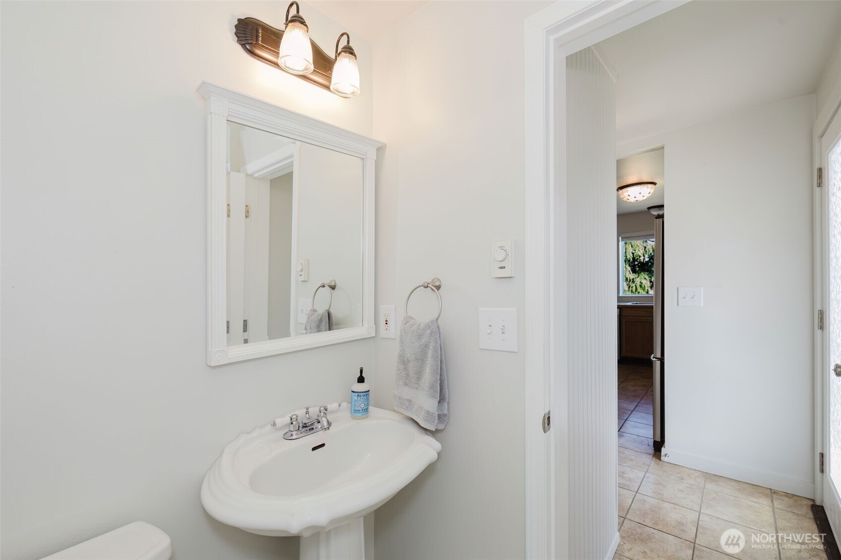131 Alpine Loop Sequim, WA 98382 - Photo 10 of 19 a bathroom with a sink and a mirror