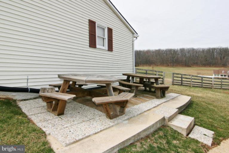 4815 Buffalo Road Mount Airy, MD 21771 - Photo 5 of 19 a view of a patio with chairs and a table