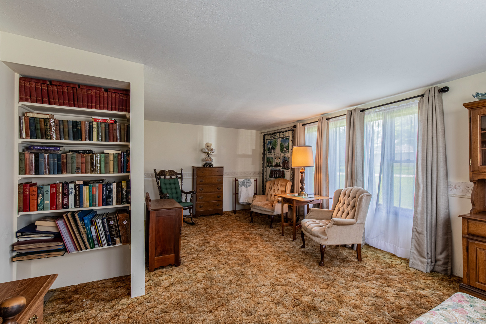 421 South Reed Street Sheffield, IL 61361 - Photo 13 of 28 a living room with furniture and a book shelf