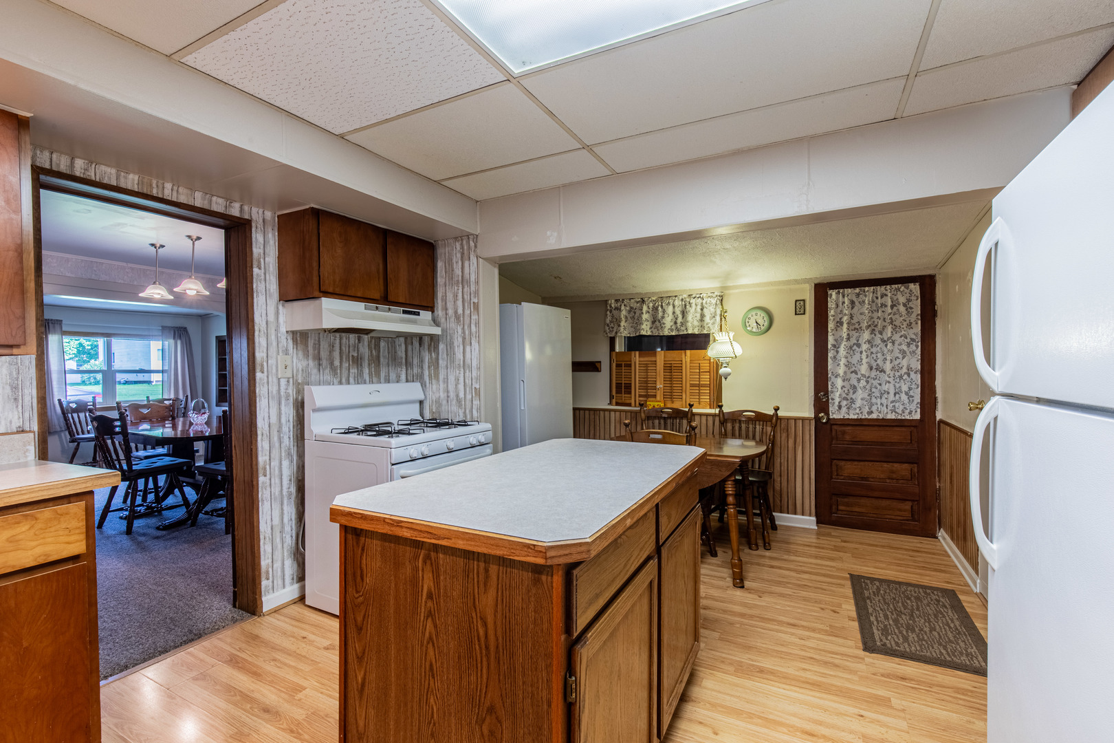 421 South Reed Street Sheffield, IL 61361 - Photo 17 of 28 a kitchen with stainless steel appliances granite countertop a refrigerator a stove and a wooden cabinets