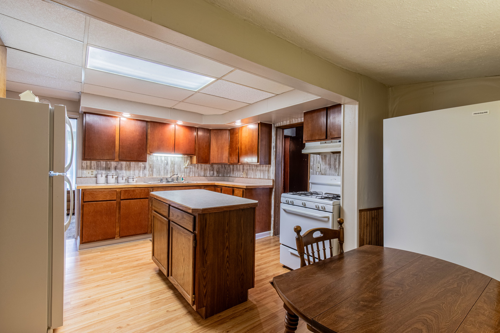 421 South Reed Street Sheffield, IL 61361 - Photo 19 of 28 a kitchen with stainless steel appliances granite countertop a stove and a refrigerator