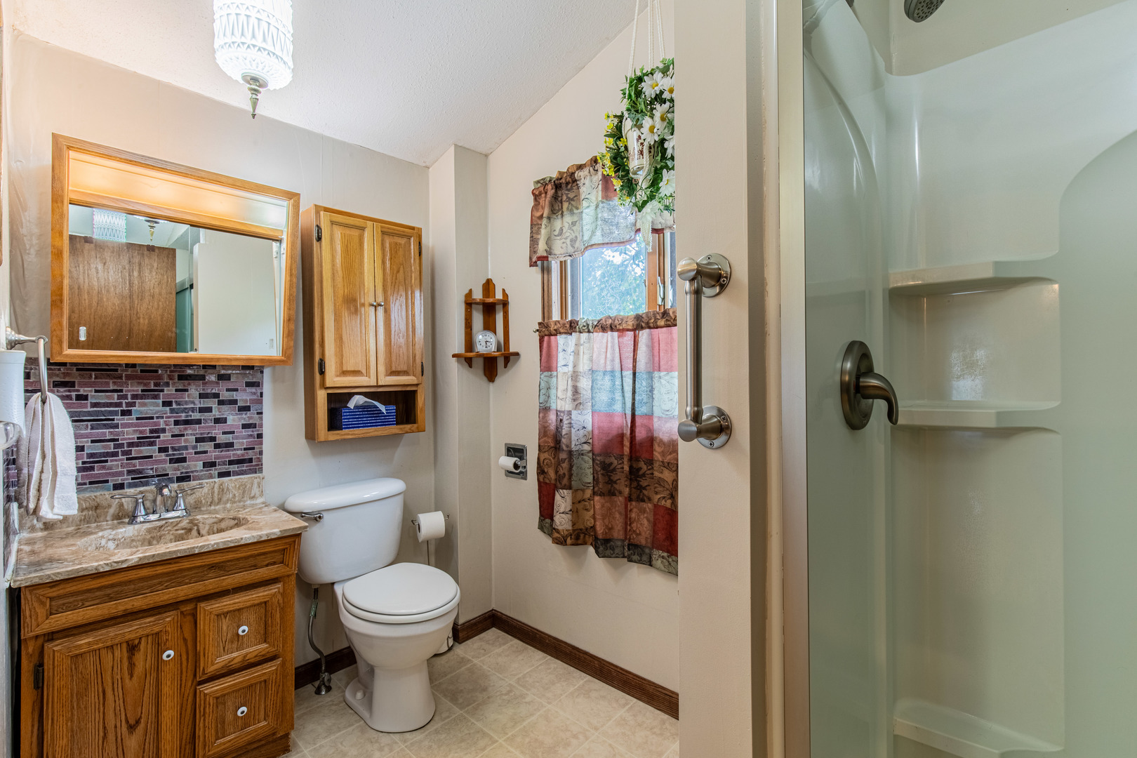 421 South Reed Street Sheffield, IL 61361 - Photo 21 of 28 a bathroom with a toilet a sink and a shower