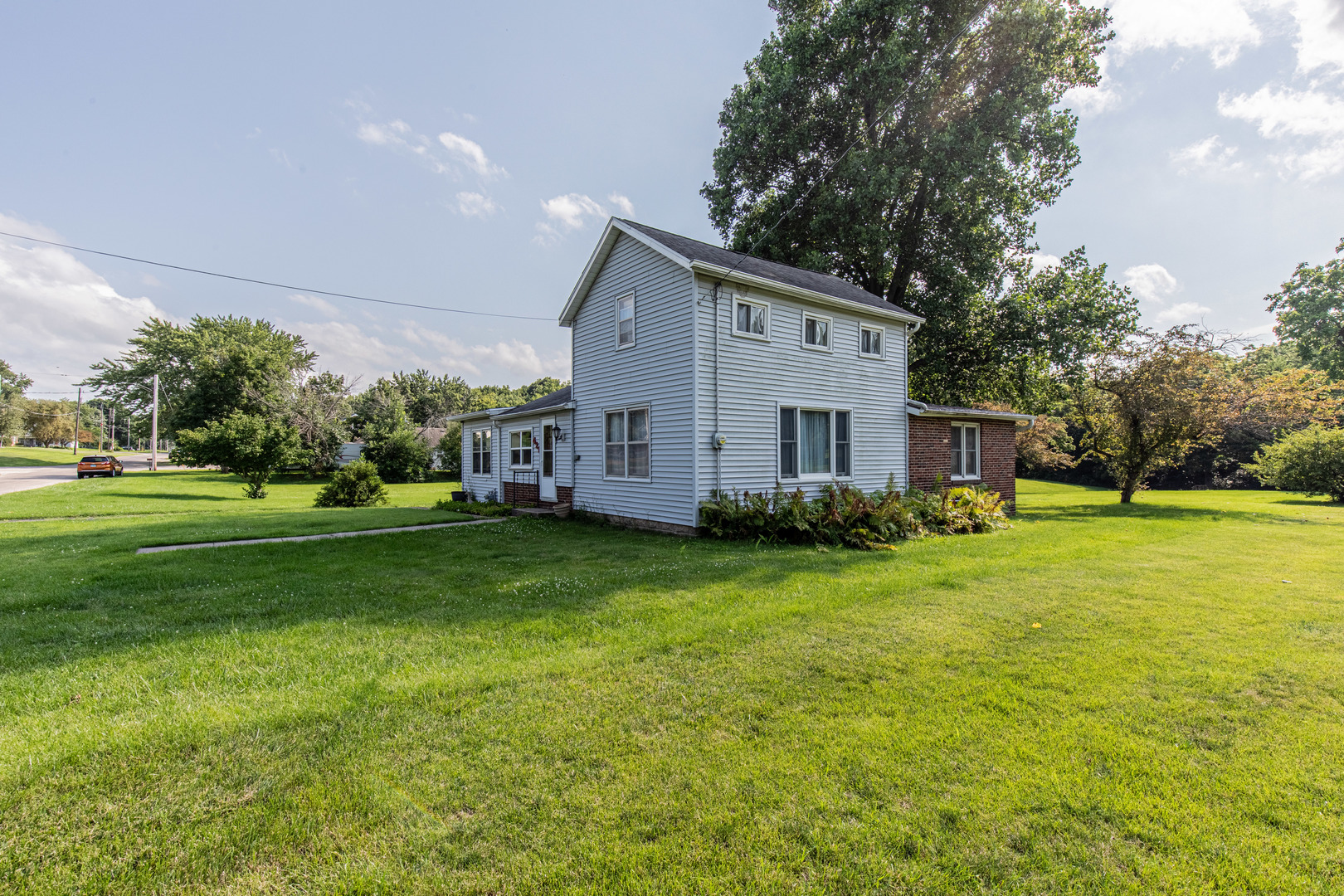 421 South Reed Street Sheffield, IL 61361 - Photo 28 of 28 a view of a house with a big yard with palm trees