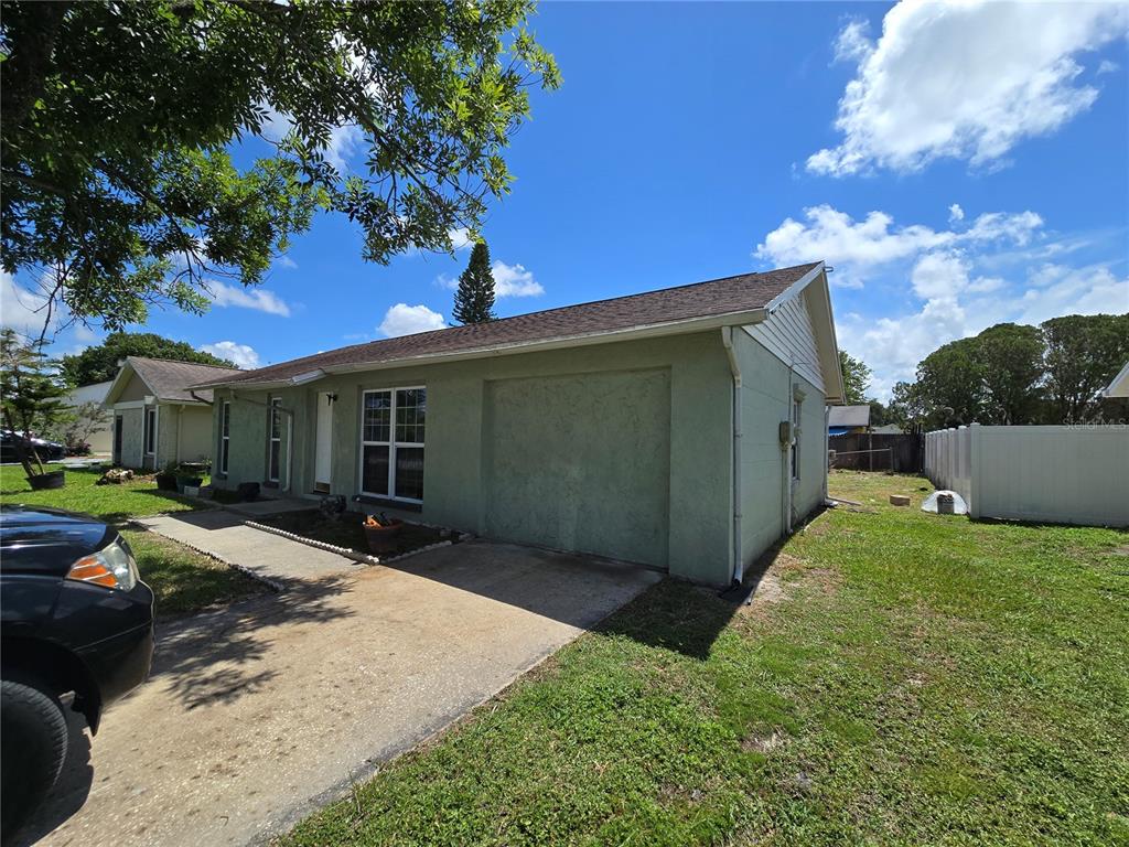 3406 Murrow Street New Port Richey, FL 34655 - Photo 2 of 21 a view of a house with backyard and sitting area