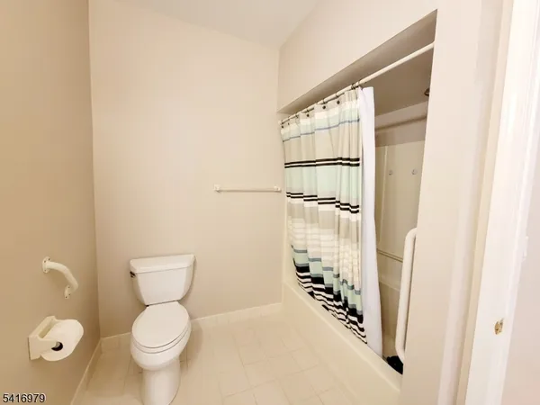 a bathroom with a toilet a sink and a shower