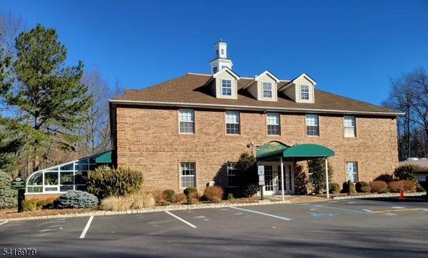 a front view of a building with street view